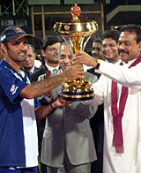 Marvan Atapattu receives the trophy after Sri Lanka's 25-run victory over India in the Asia Cup final © CricInfo Ltd
